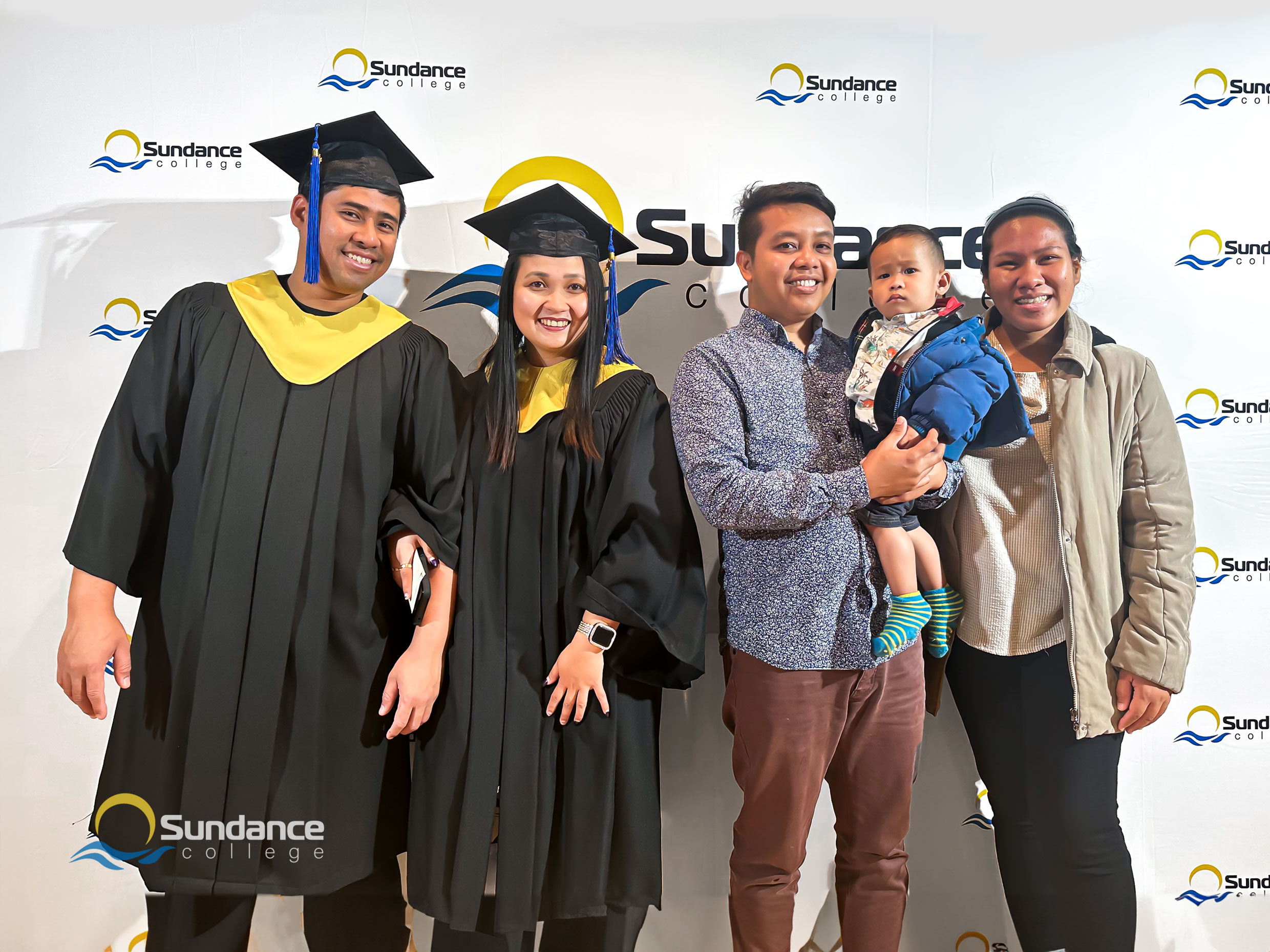 Analyn F., Sundance College's Addictions and Community Health Professional gradute with her family at the Graduation Ceremony in Edmonton, 2023