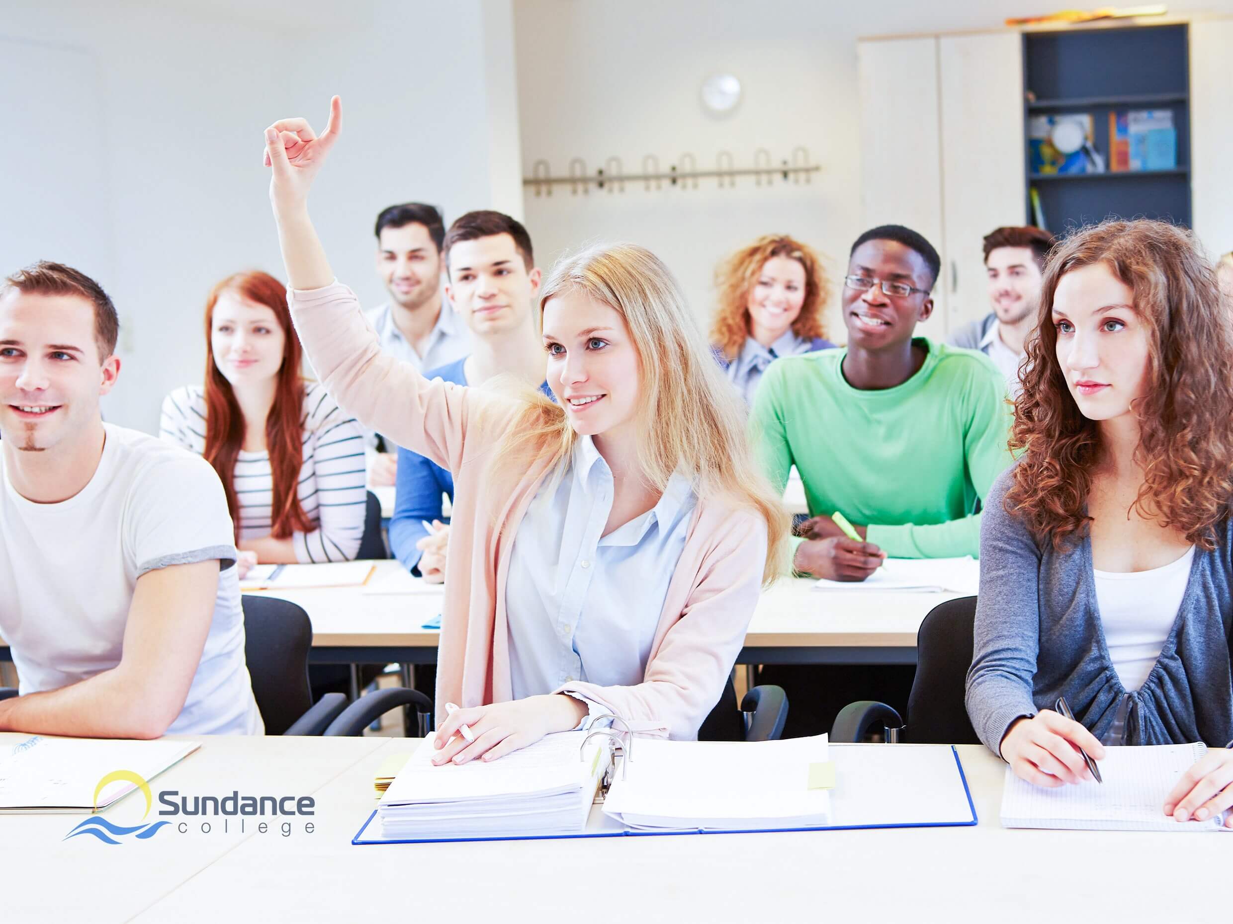 a diligent female business student raising hand to answer question in business courses.