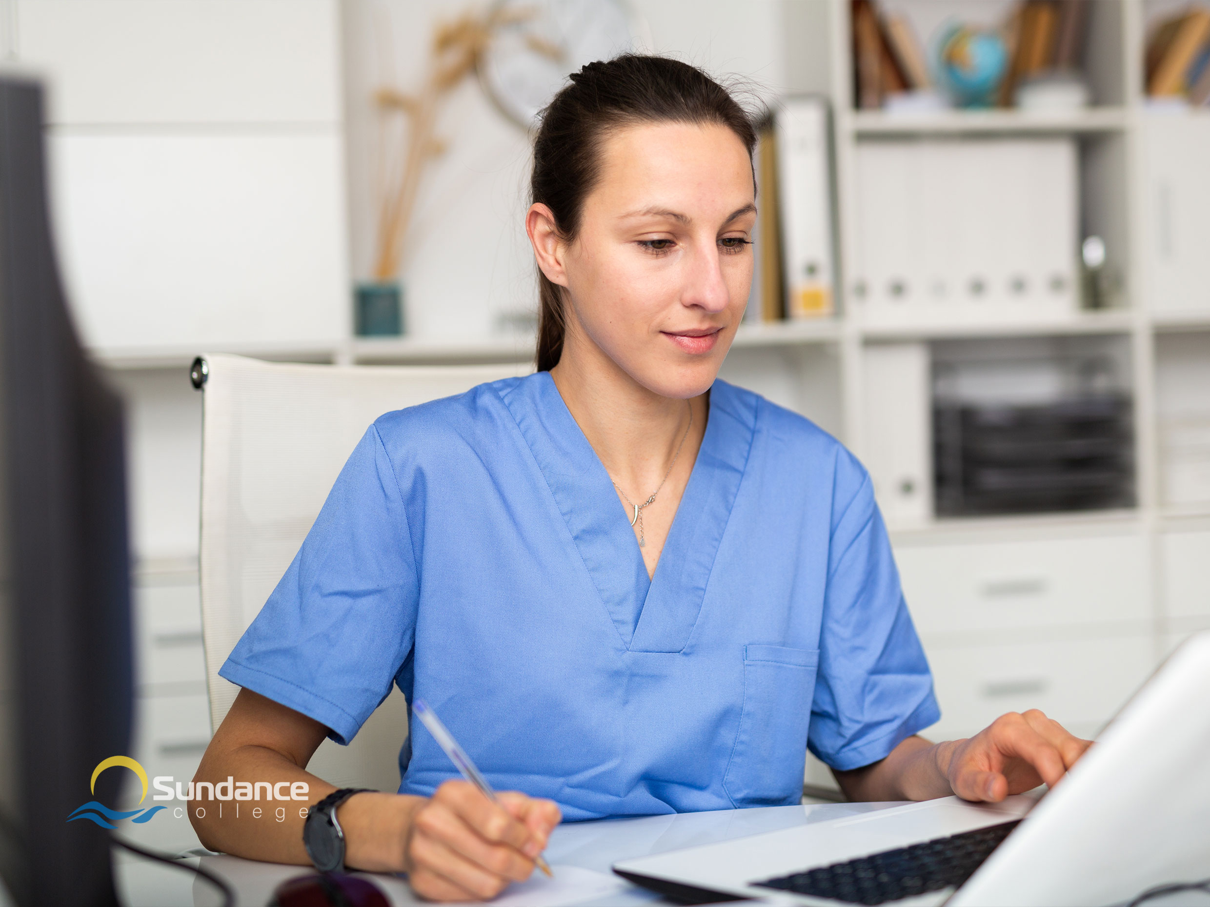 A Medical Office Assistant working on medical transcriptions