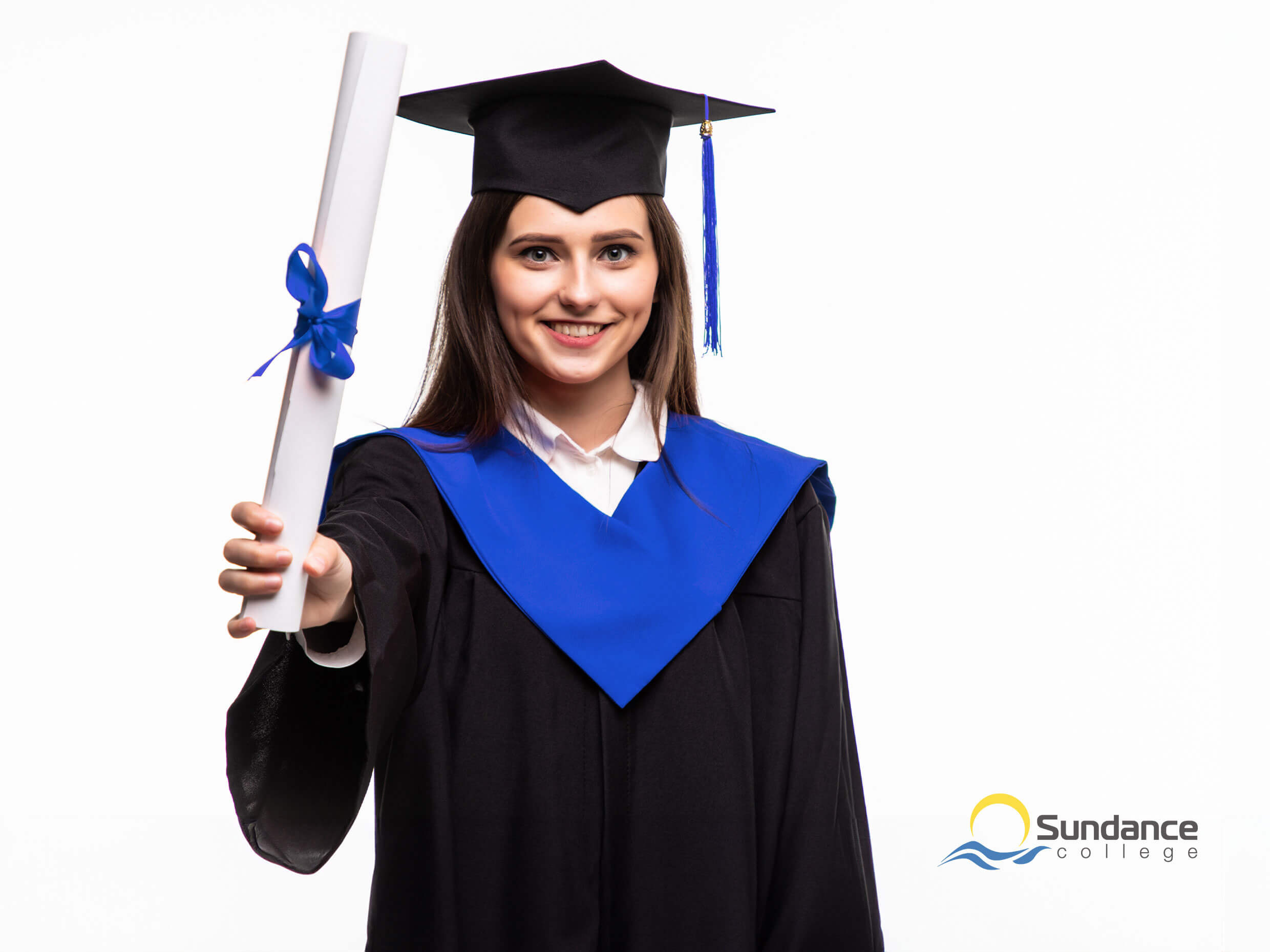 accounting, tax, and payroll diploma graduate in cap and gown holding diploma smiling at camera, showing diploma as most important step in becoming bookkeeper