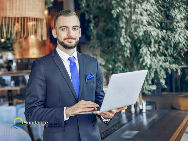 A restaurant manager preparing his marketing analysis for recent campaign.