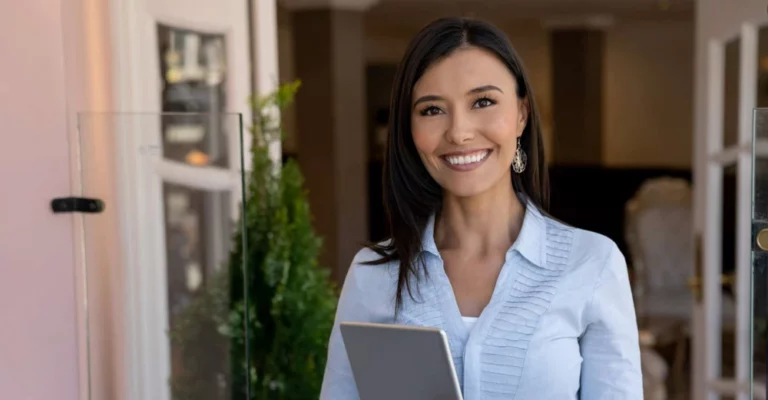 a women standing with a tablet hospitality industry entry level