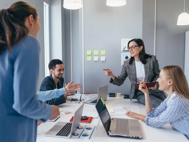 a group of people around a table human resource