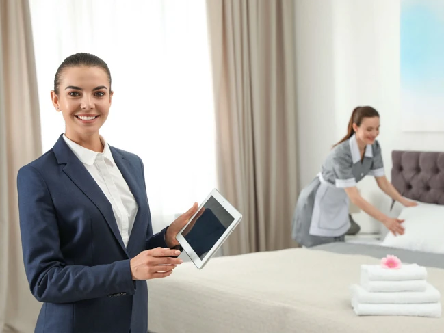 hospitality staff working in hotel room