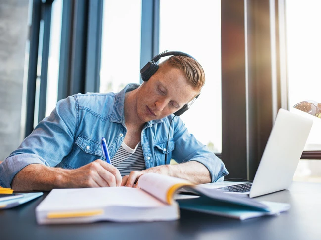 Male student taking online classes