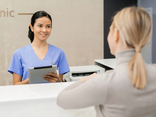 Medical office assistant and patient medical office reception.