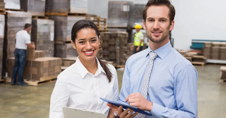 a man and woman in a warehouse supply chain management