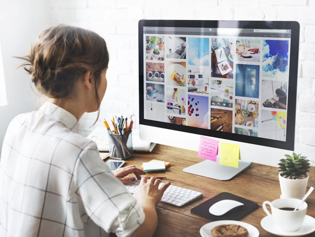 a woman sitting at a computer