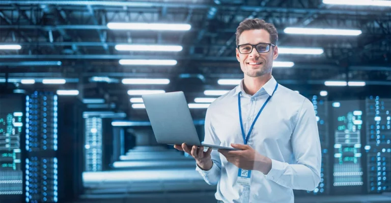 a man holding a laptop