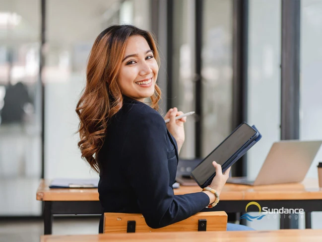 Business woman holding a tablet in hand