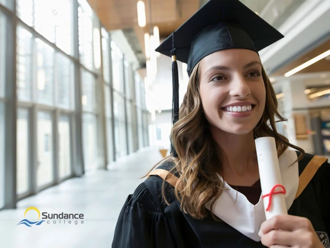 female college student graduate in cap and holding diploma