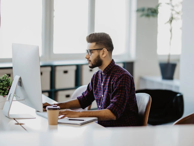 male accountant working on computer