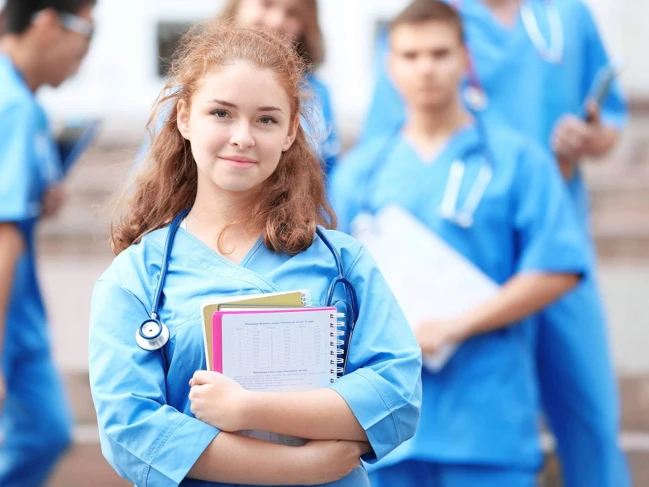 medical office assistant student standing in class