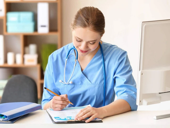 medical transcriptionist on desk inside a clinic.