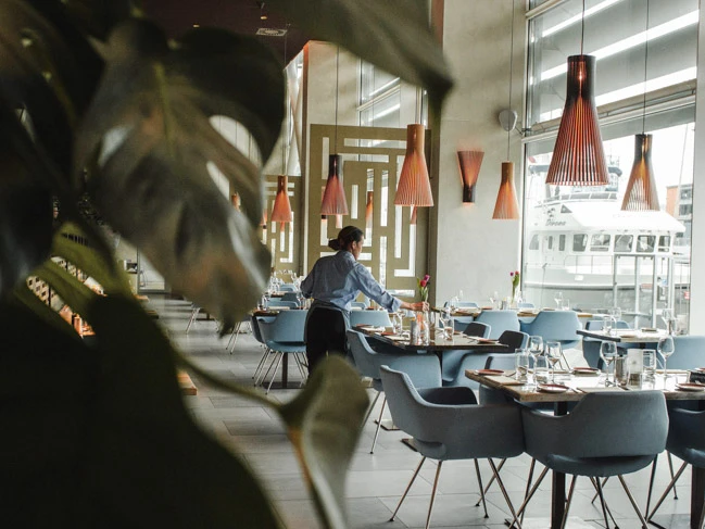 restaurant staff preparing the tables for opening.