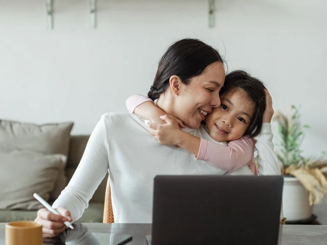 a woman hugging a child