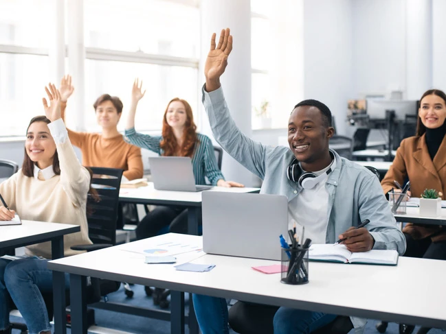 a group of people raising their hands