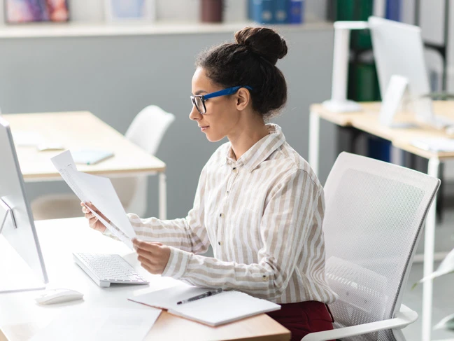 woman doing accounting and payroll tasks