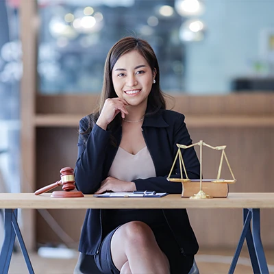 A legal assistant sitting at a desk.