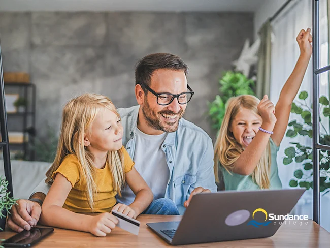 An adult college student spending time with his kids maintaining college life balance.