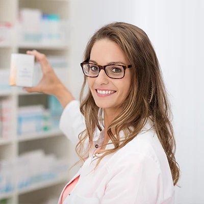 A pharmacy assistant distributing medication.