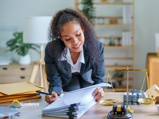 Legal assistant working with a lawyer on a case file.