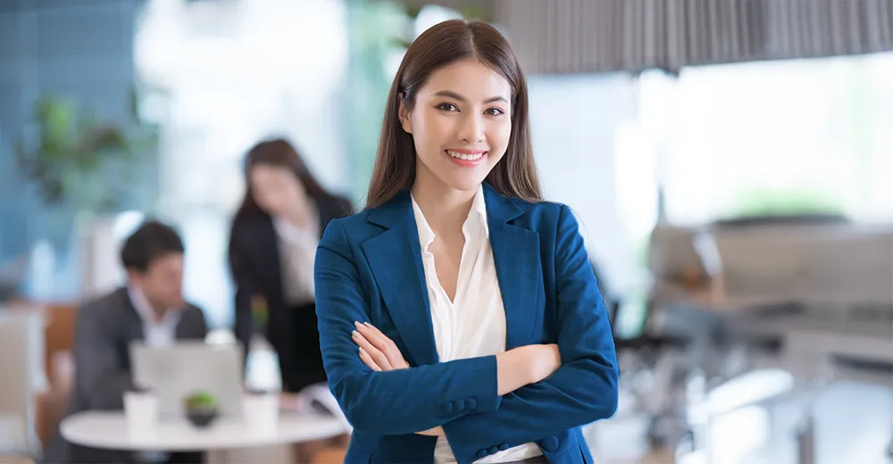 Smiling female professional, representing career training success with diploma programs and flexible learning.