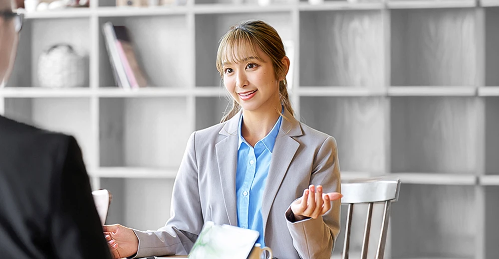 Woman in blazer communicates well in an interview from soft skills she developed at Sundance College.
