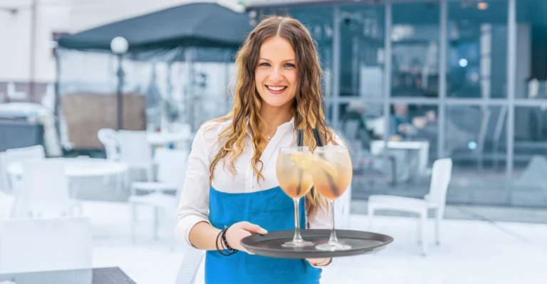 Seasonal event worker in high- visibility jacket gaining real-world job experience at Calgary Stampede.