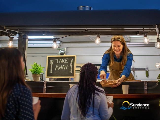Food truck hospitality worker serving guests at the Calgary Stampede.