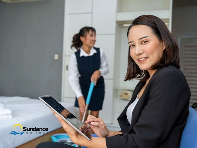Hotel front desk staff assisting guests – real-world hospitality experience in action.