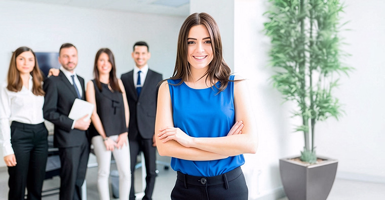 A woman smiles in an office, an example of planning your future on Blue Monday