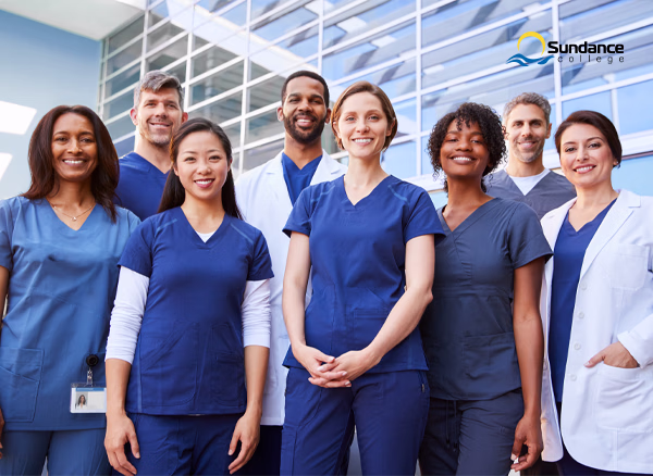 A team of Personal Support Workers standing together in a healthcare setting.