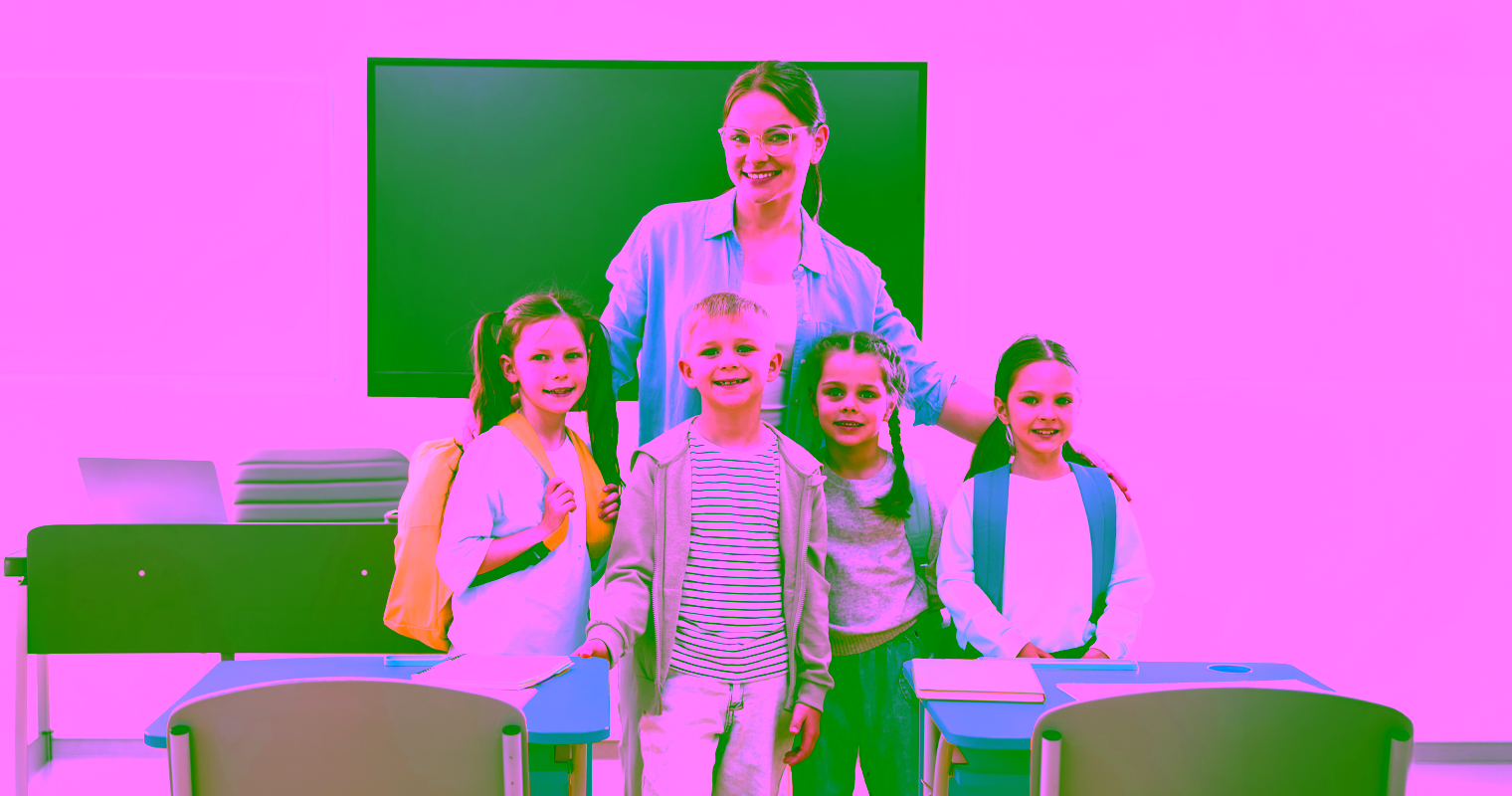 Education Assistant with students in a classroom setting.