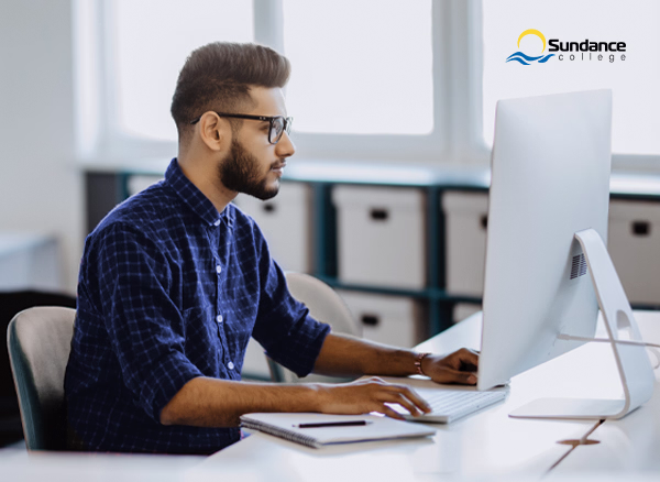Accounting, tax, and payroll professional at workstation.